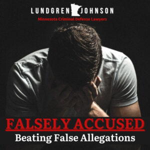 Man in despair sitting behind text that says falsely accused, beating false allegations