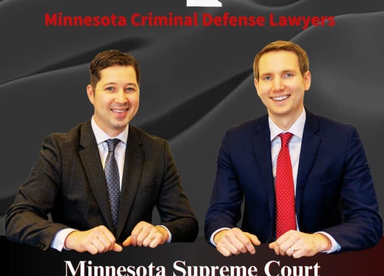 Two Criminal Lawyers sitting and smiling