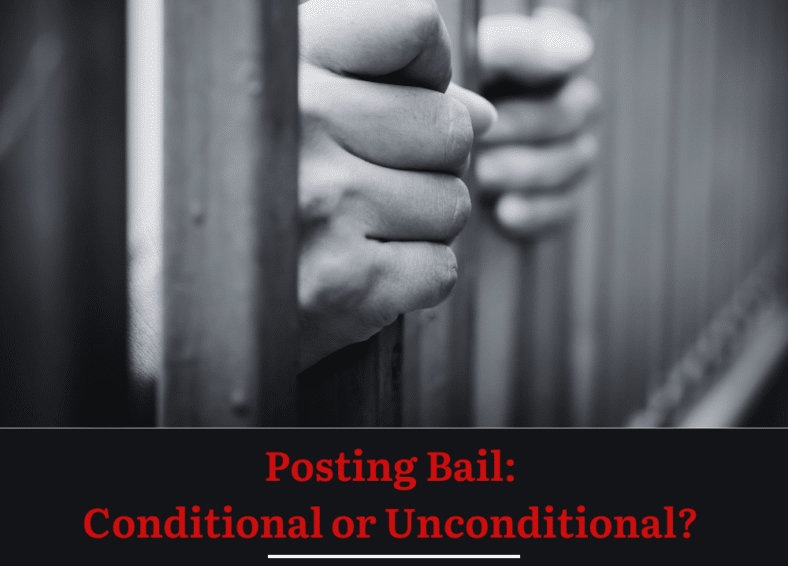 Picture of two hands holding onto the bars of a jail