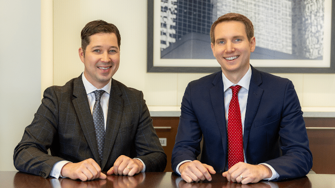 Minnesota First Degree Criminal Sexual Conduct lawyers sitting at a table