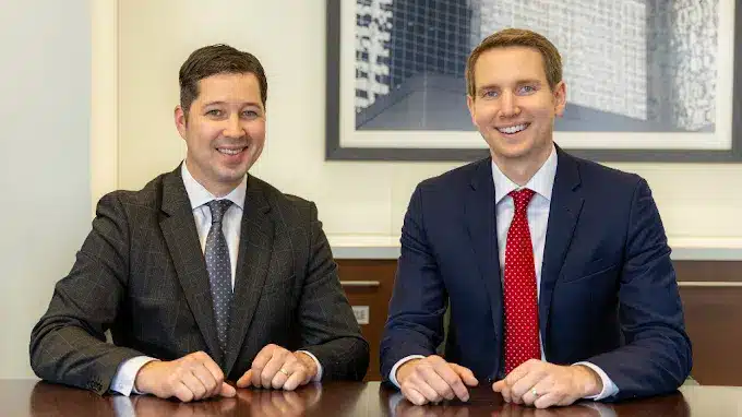 Minnesota Fourth Degree Criminal Sexual Conduct lawyers sitting at a table